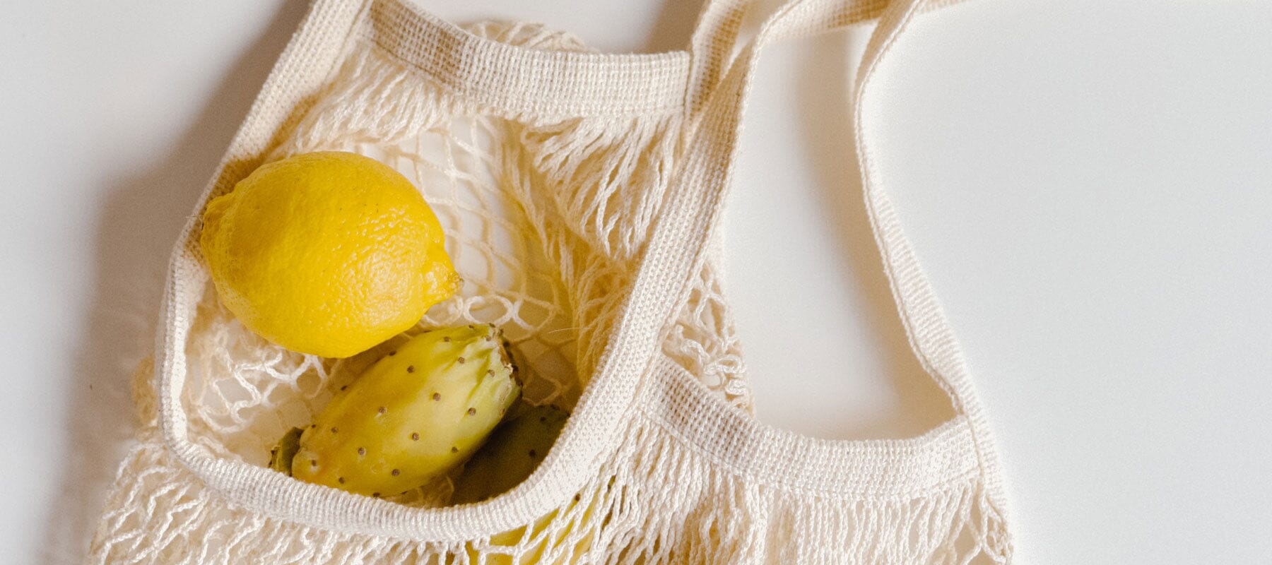 string shopper back containing fruit
