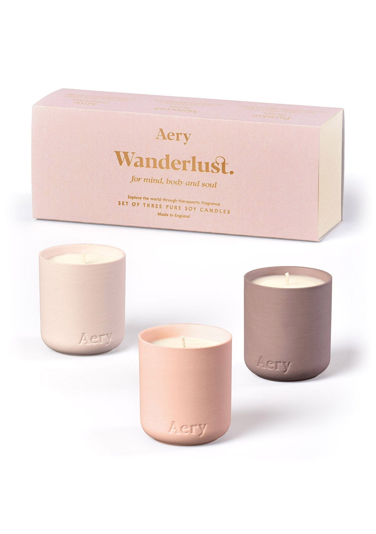 Blush Wanderlust candle set of three by Aery displayed next to product  packaging on white background 