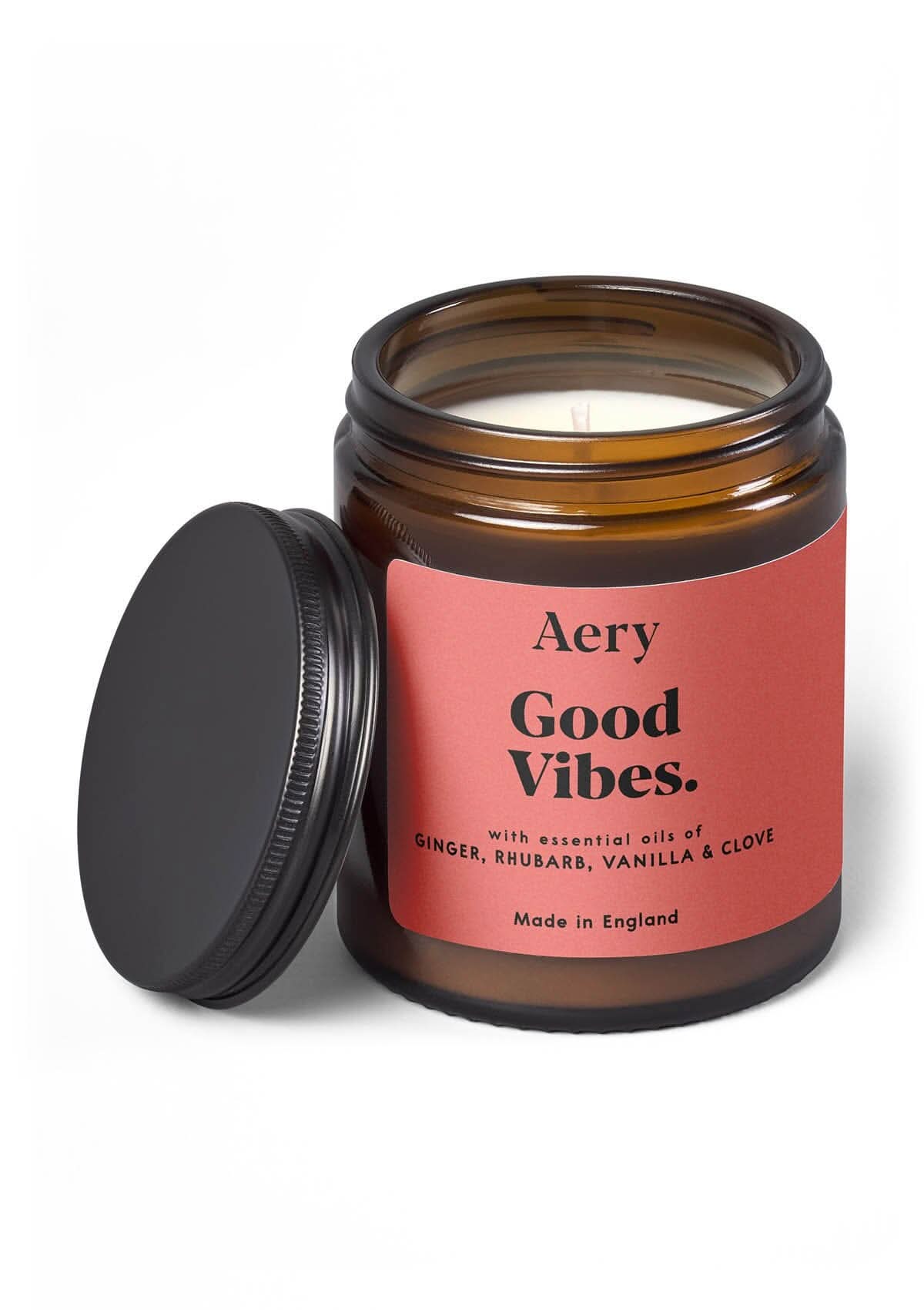 Red Good Vibes jar candle with lid on white background