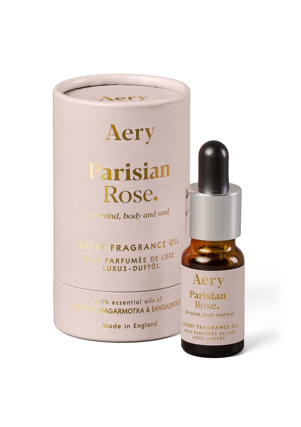 Pink Parisian Rose fragrance oil displayed next to product packaging by Aery on white background 