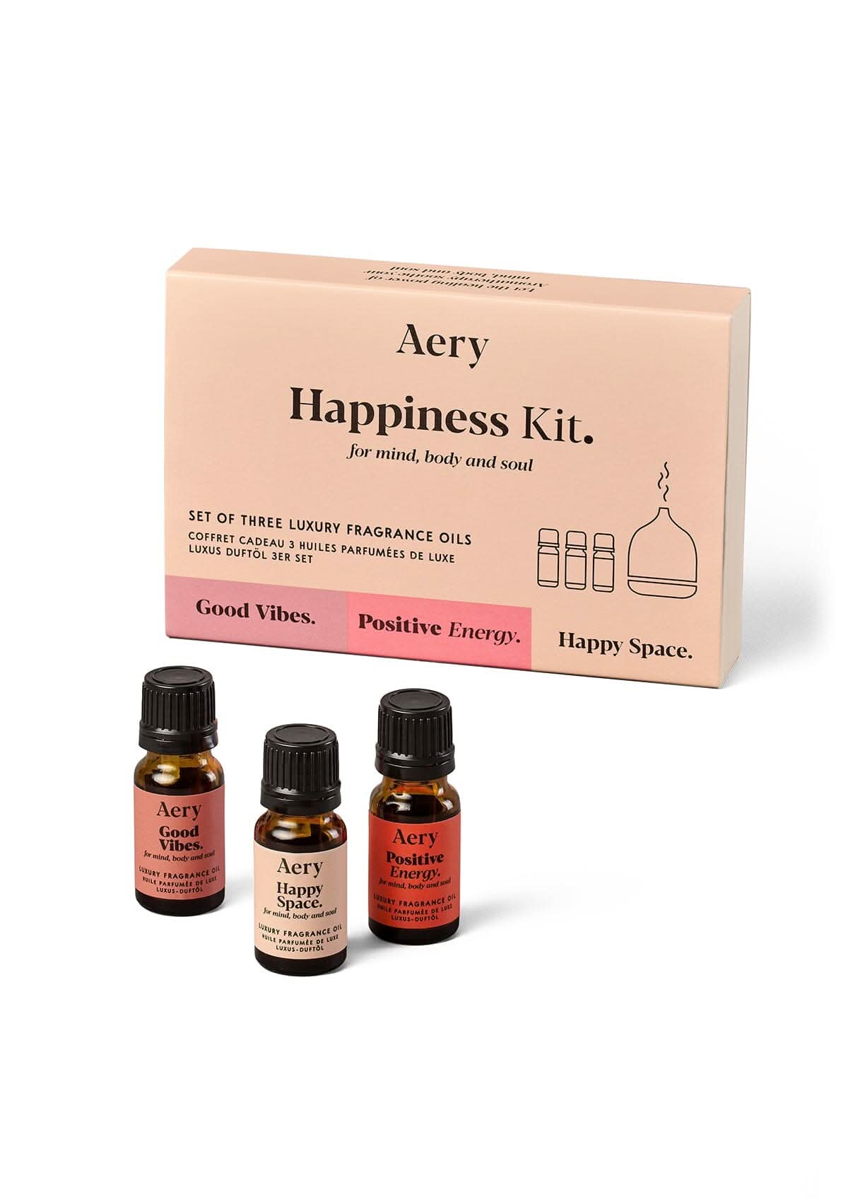 Pink Happiness Kit fragrance oil set of three displayed next to product packaging by Aery on white background