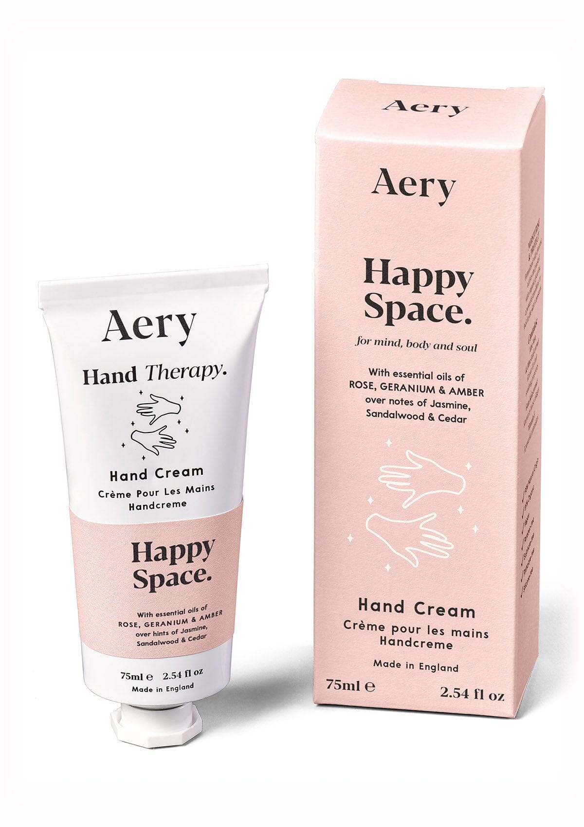 Pink Happy space hand cream displayed next to product packaging by Aery on white background 