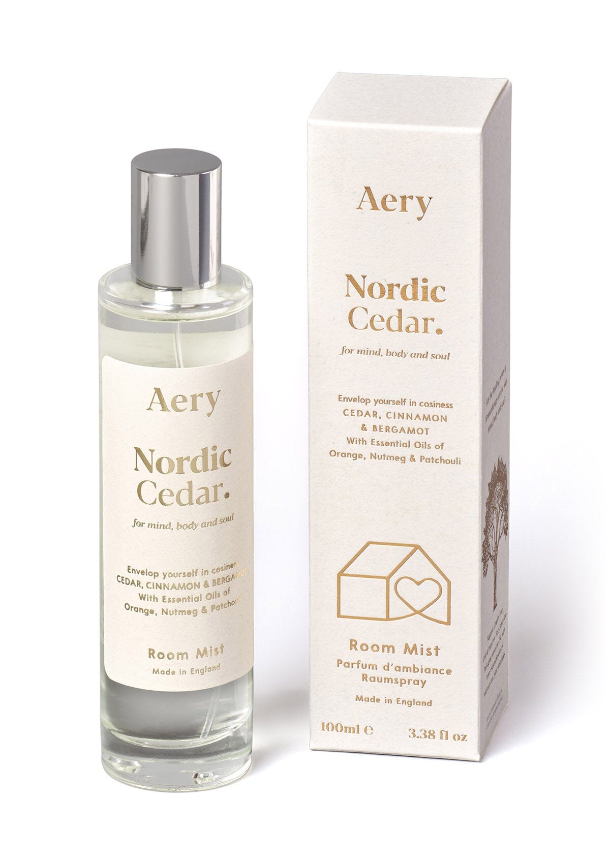 White Nordic Cedar room mist displayed next to product packaging by Aery on white background 