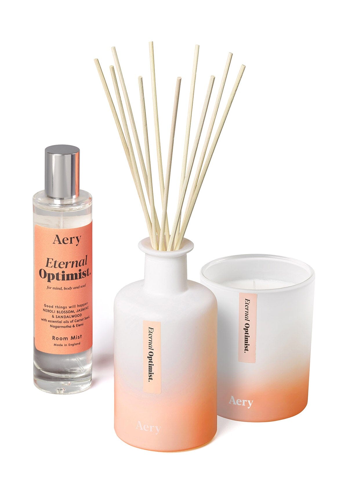 Orange Eternal Optimist diffuser, room mist and candle by aery displayed on white background 