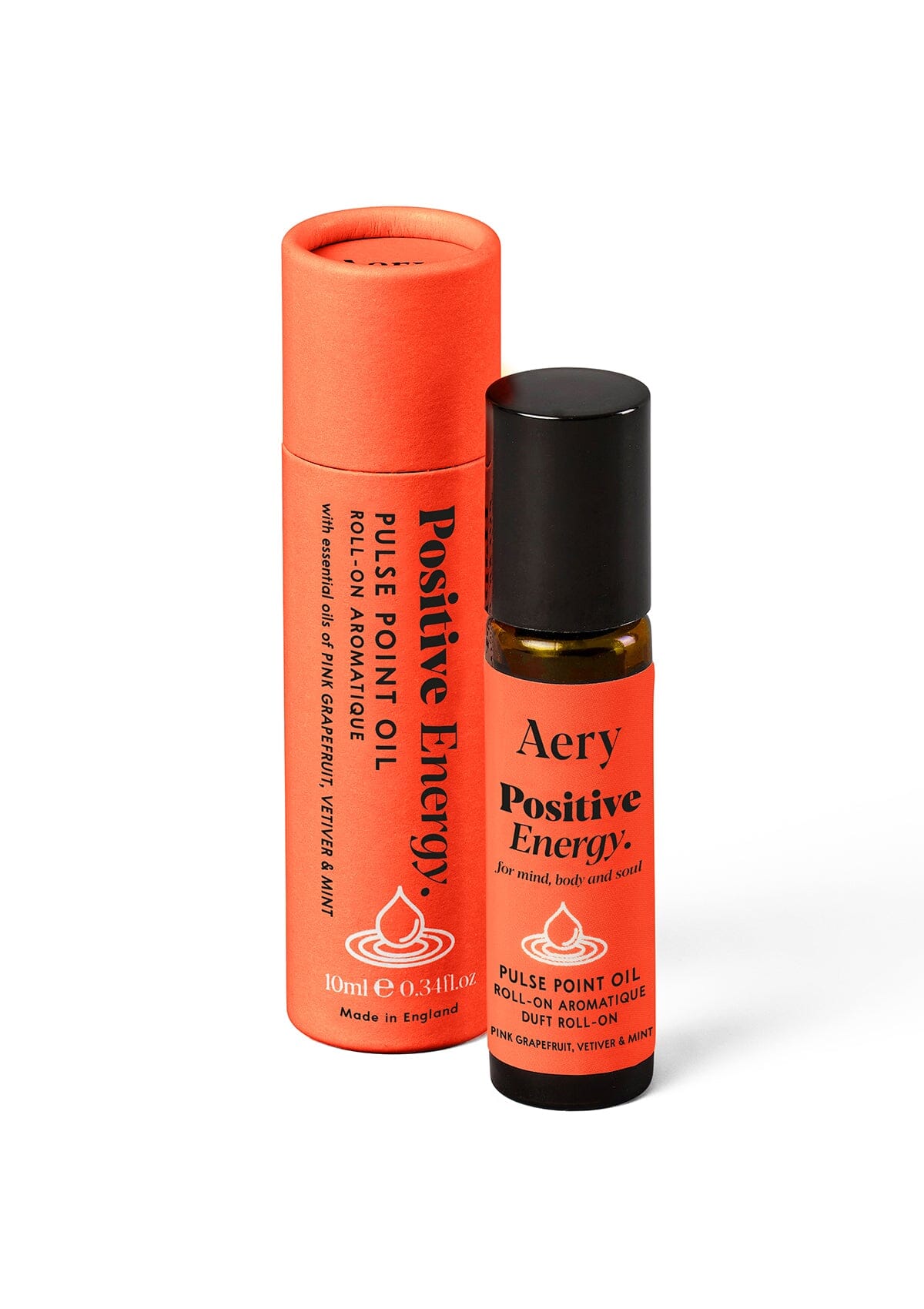 Orange Positive Energy Pulse Point Oil displayed next to product packaging by Aery on white background 