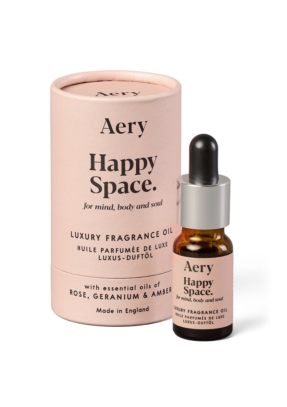 Pink Happy Space fragrance oil displayed next to product packaging by Aery on white background 