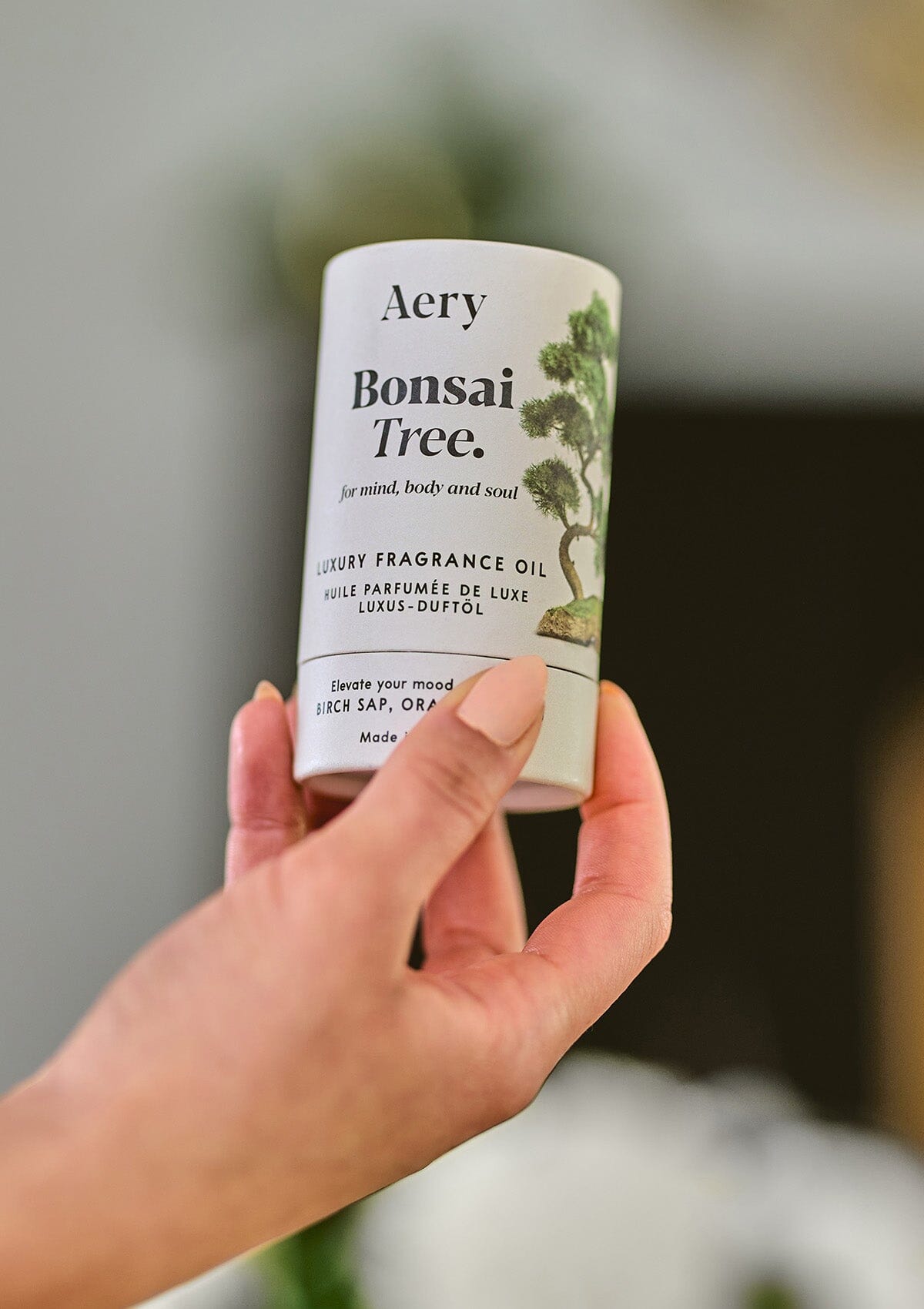 Bonsai Tree fragrance oil by Aery held in hand 