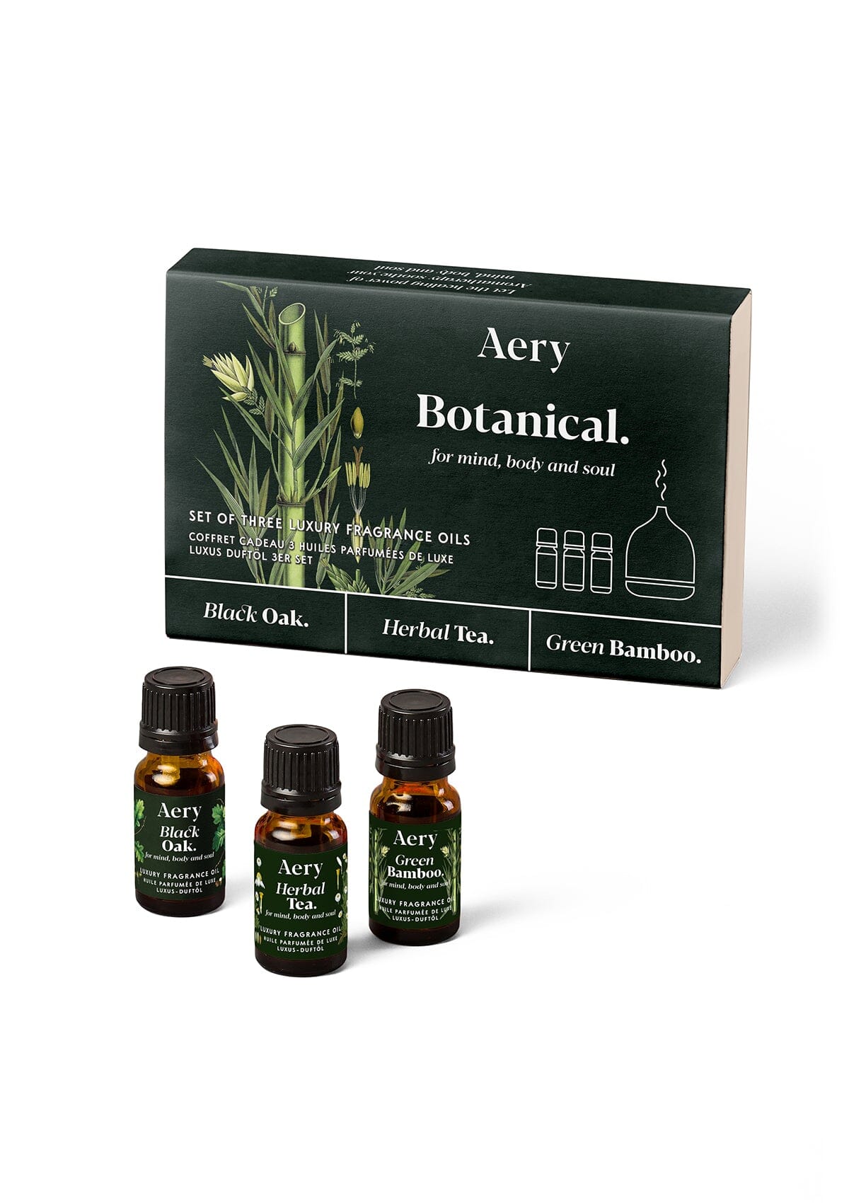 Green Botanical fragrance oil set of three displayed next to product packaging by Aery on white background 