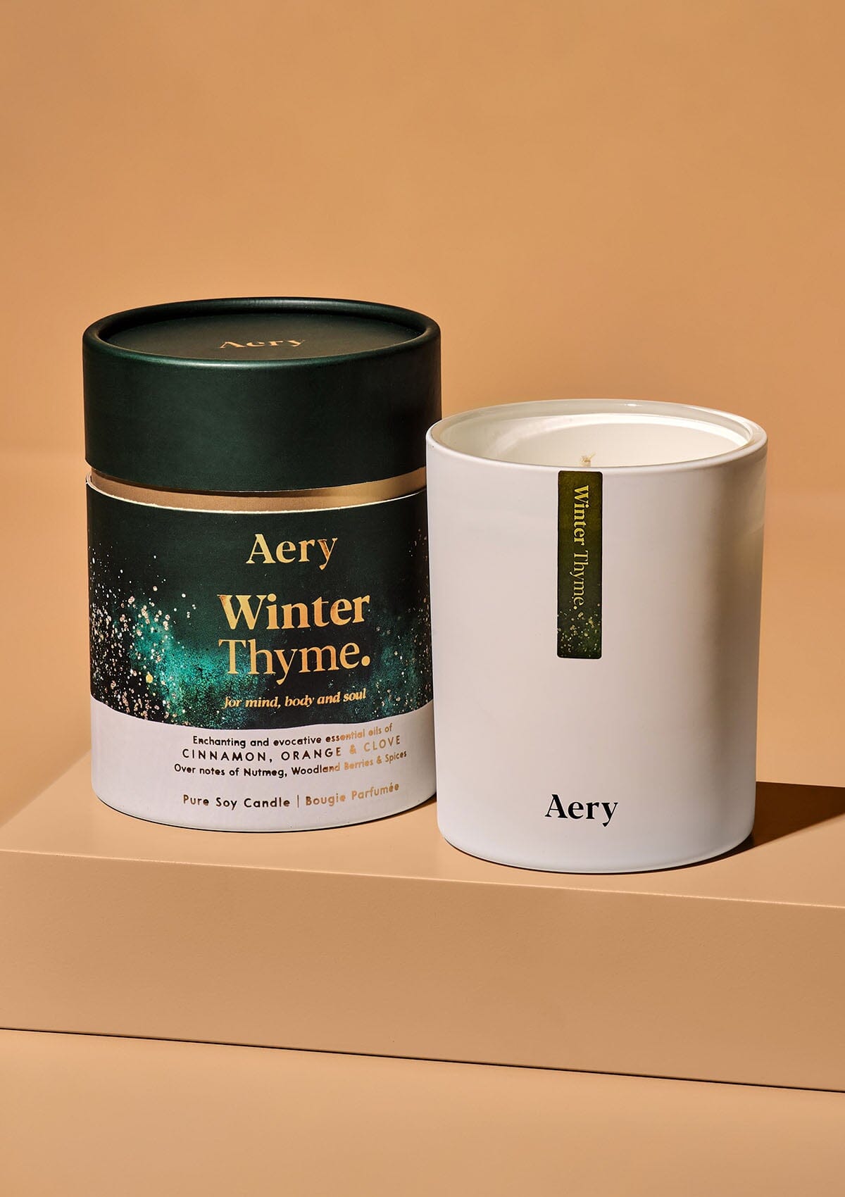 winter thyme scented candle displayed next to decorative product packaging