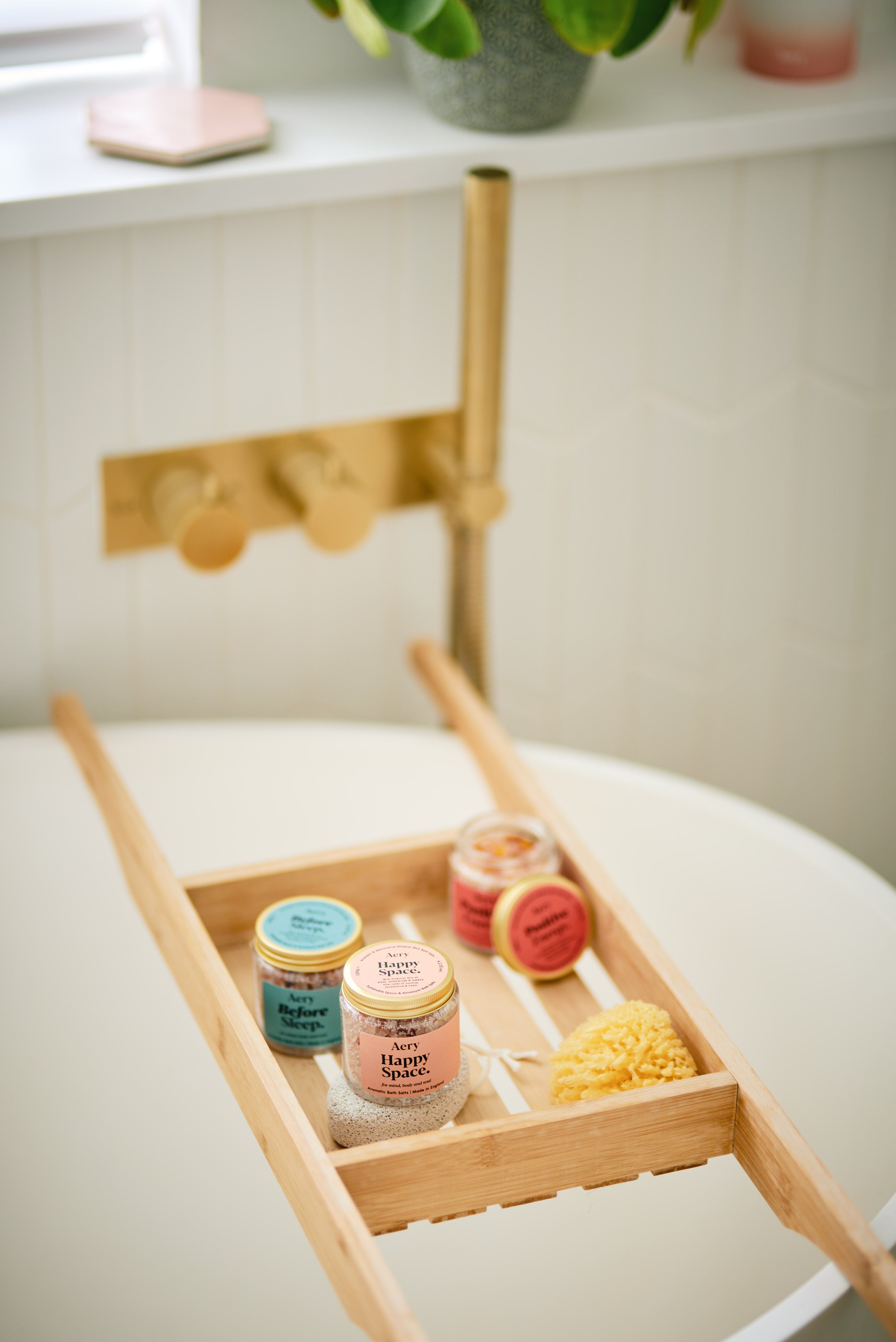 Positive Energy bath salts gift set by Aery displayed in bath tray  in bath room 
