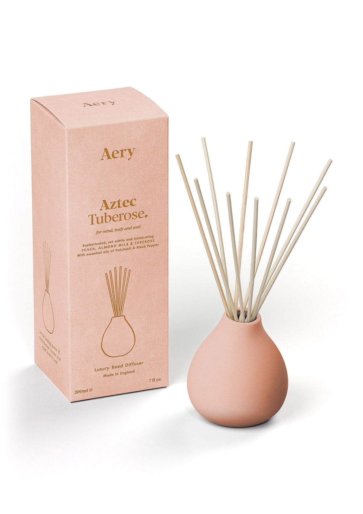 Peach Aztec Tuberose diffuser displayed next to product packaging by Aery on white background 