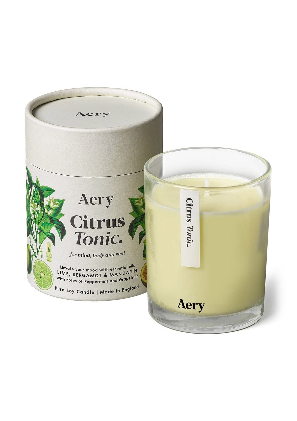 Cream Citrus Tonic glass scented candle displayed next to product packaging on white background 