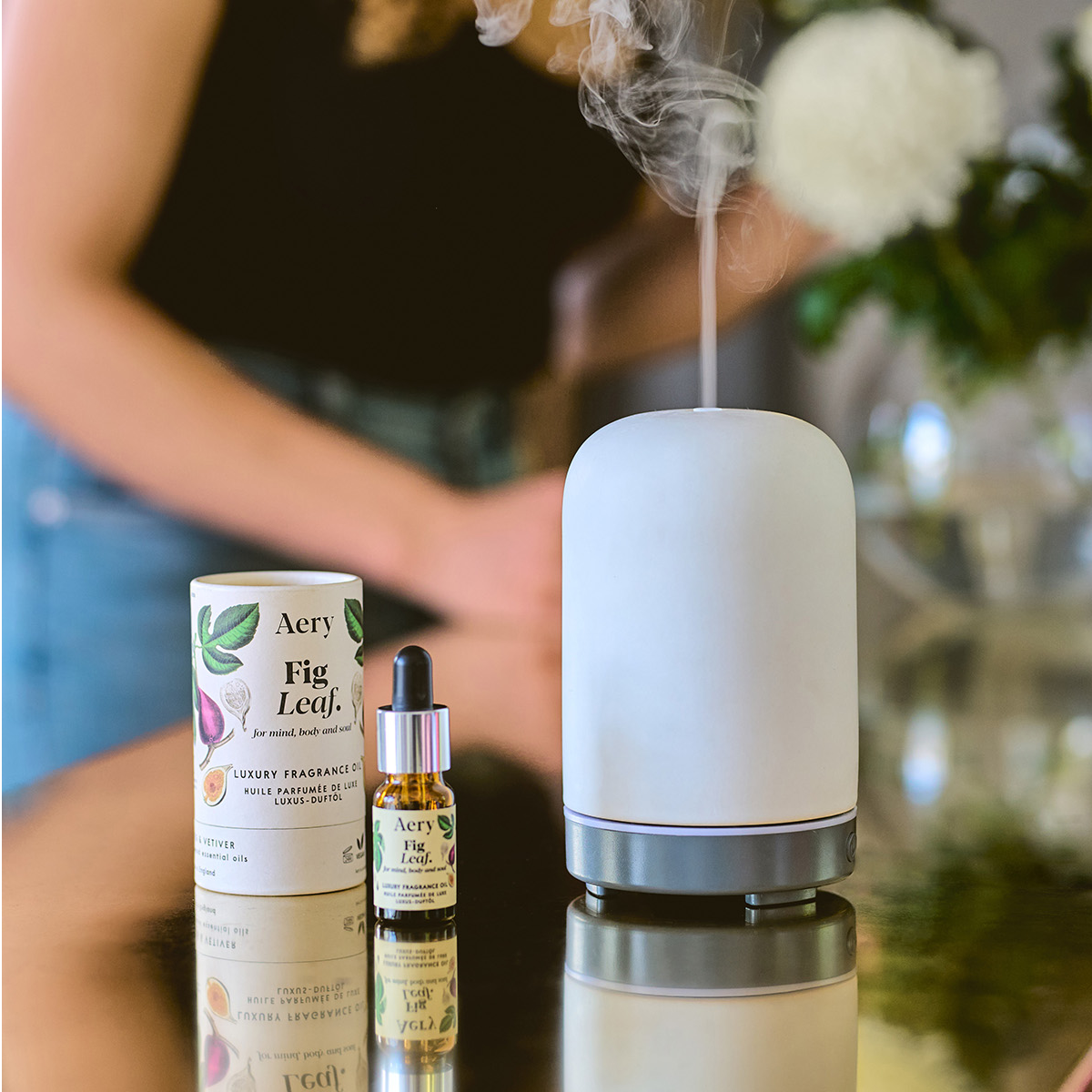 Fig Leaf fragrance oil displayed next to electric diffuser 