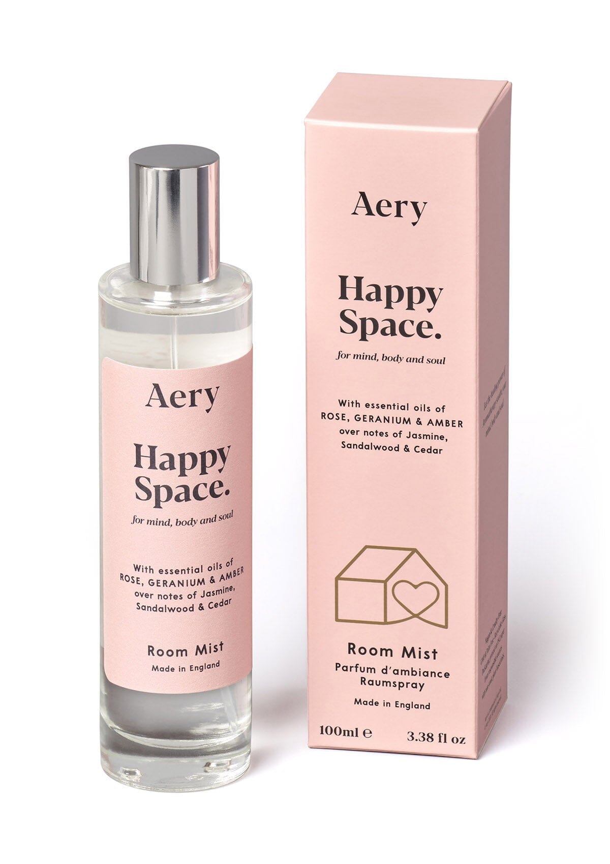 Pink Happy Space room mist displayed next to product packaging by Aery on white background 