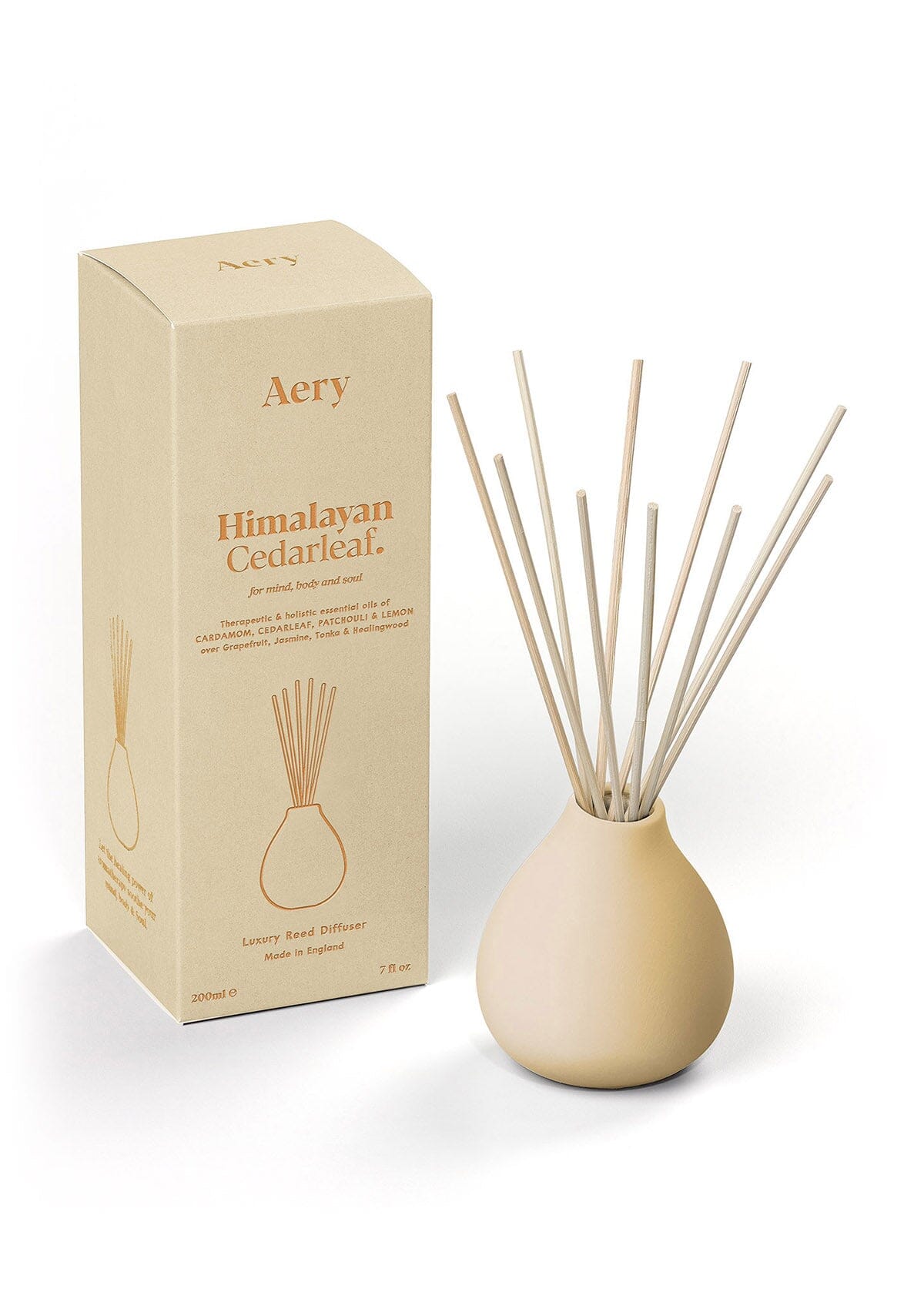 Cream Himalayan Cedarleaf diffuser with product packaging by Aery 