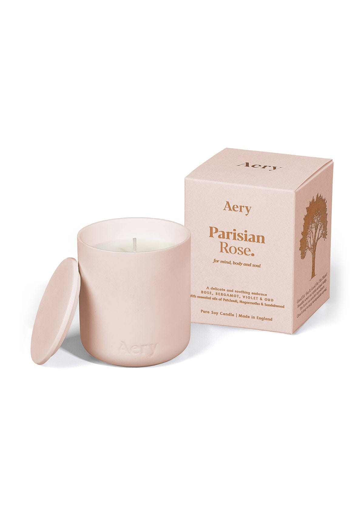 Pale pink ceramic Parisian Rose scented candle displayed next to product packaging by Aery on white background 