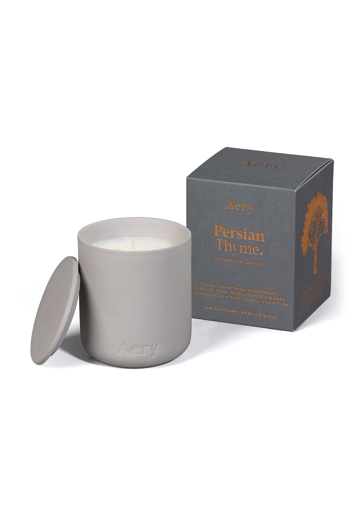 Grey ceramic Persian Thyme scented candle displayed next to product packaging by Aery on white background 