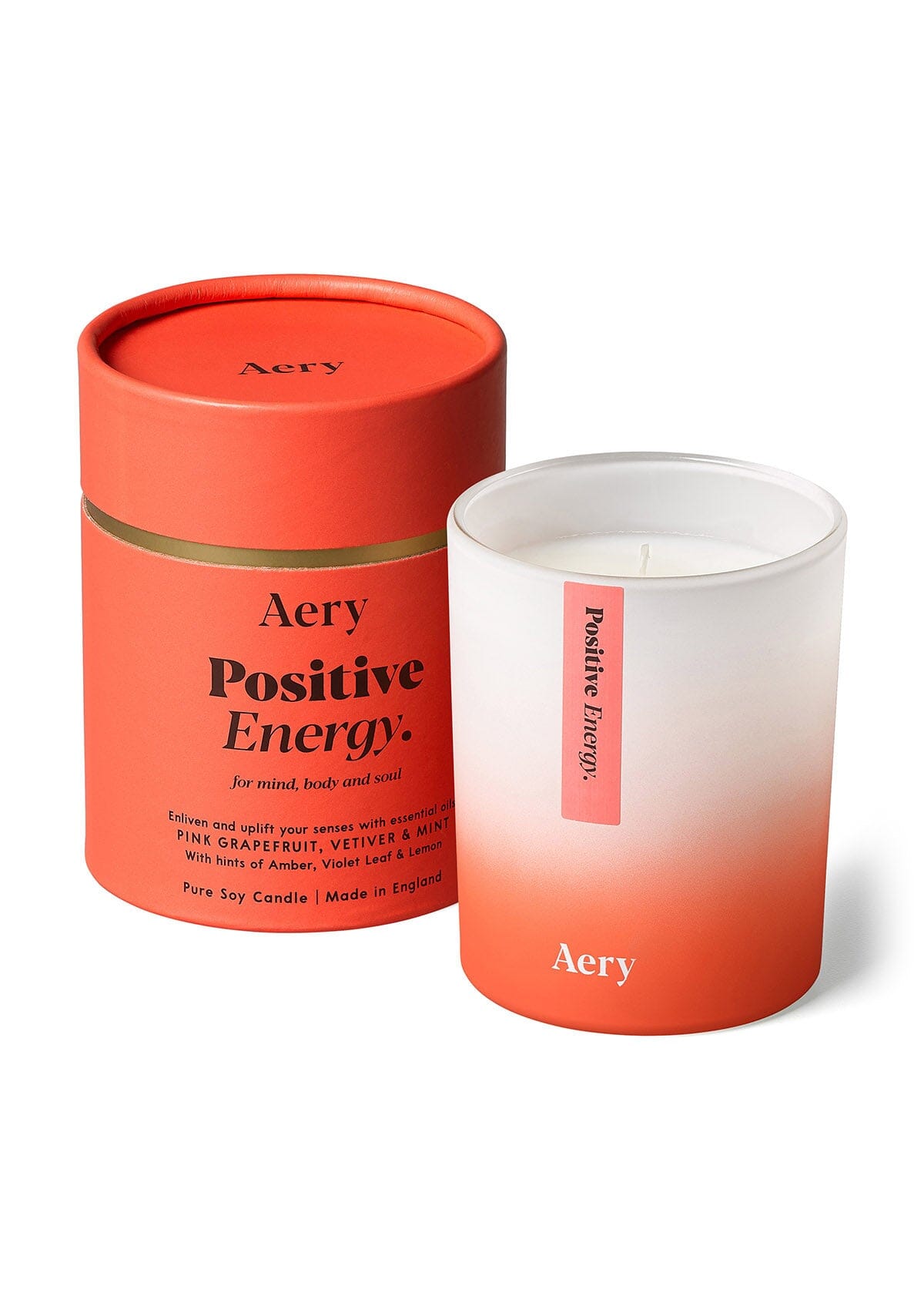 red positive energy candle with product packaging by Aery