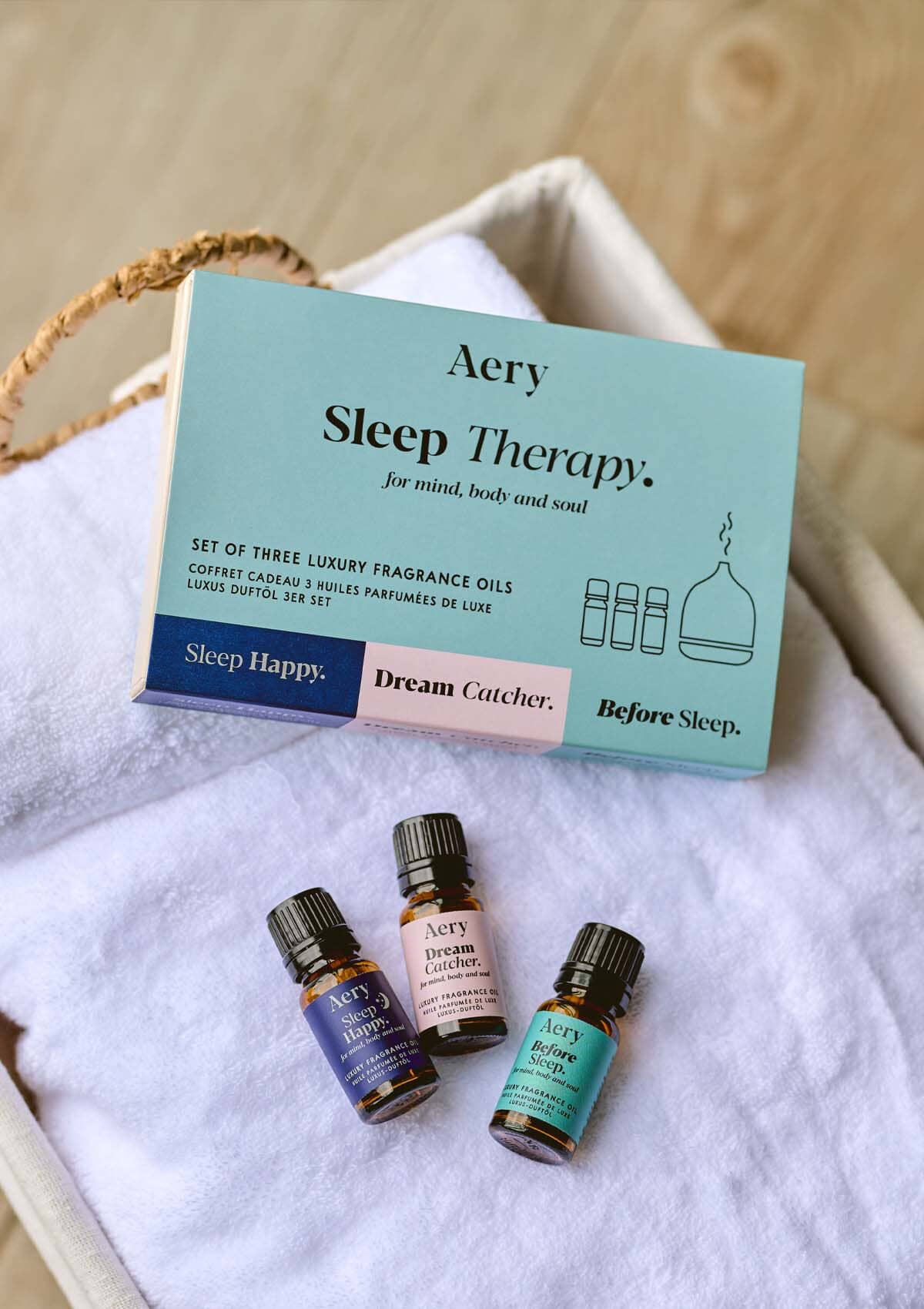 Sleep Happy set of fragrance oil placed on white towel 