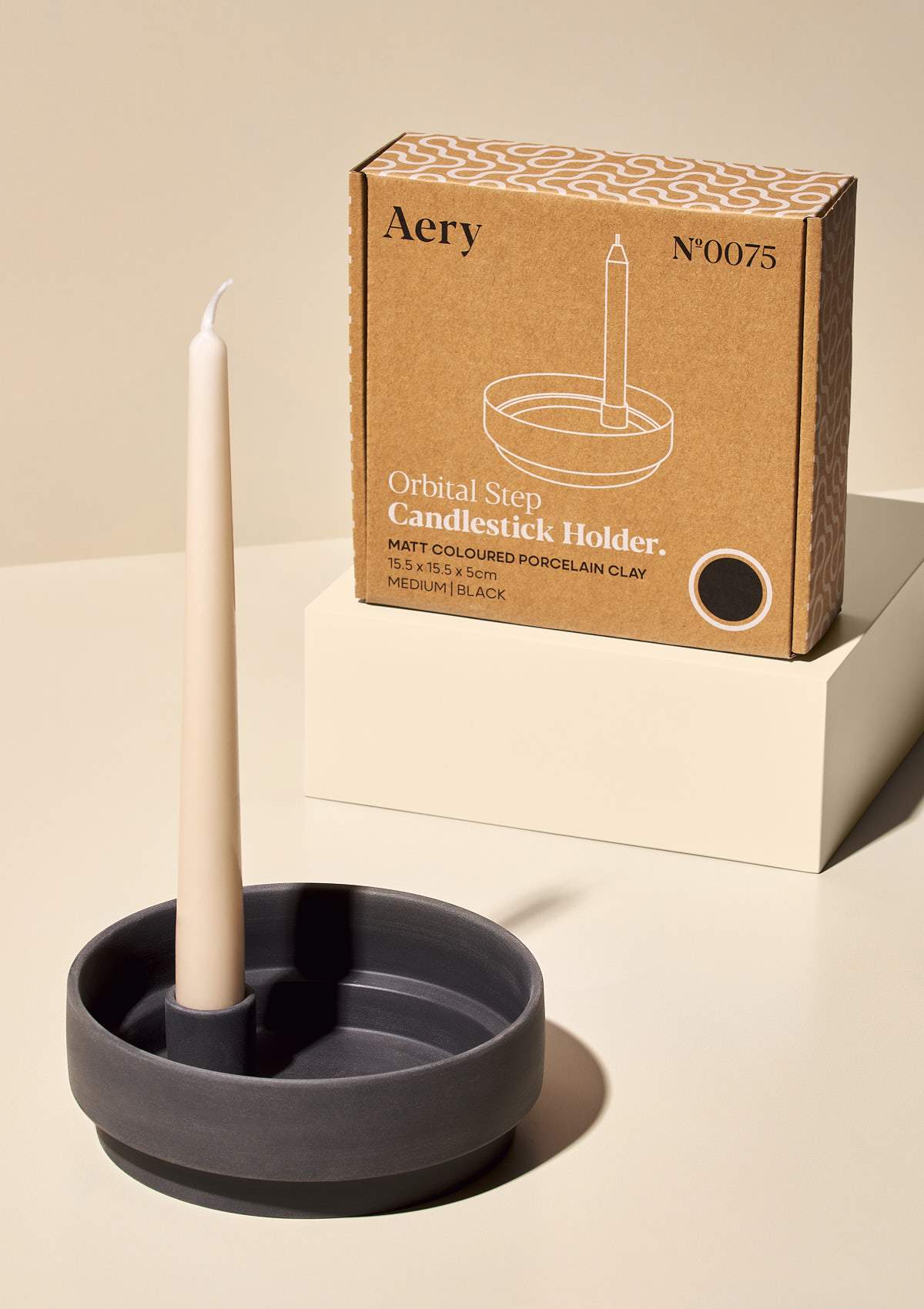 aery dark grey ceramic candle holder with kraft box packaging and cream candle