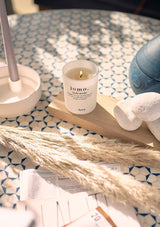 kitchen table setting with decorative centre piece and lit jomo candle