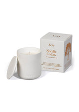 aery living white ceramic nordic cedar scented candle next to white product packaging